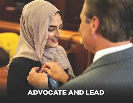Woman with a hijab smiling with the District Attorney