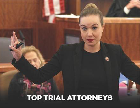 Woman standing and speaking in a courtroom
